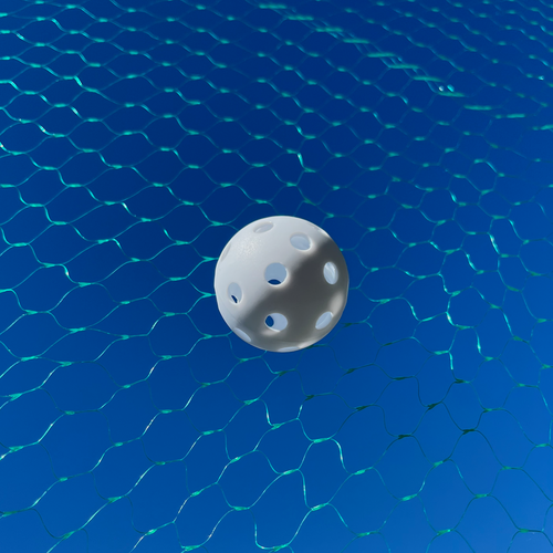 A white small ball caught in blue-green batting cage netting
